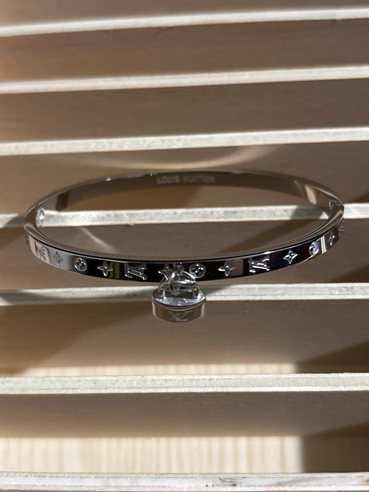 Luxury Silver-Tone Monogram Motif Bangle Bracelet with Miniature Padlock Charm 🔐🪨✨