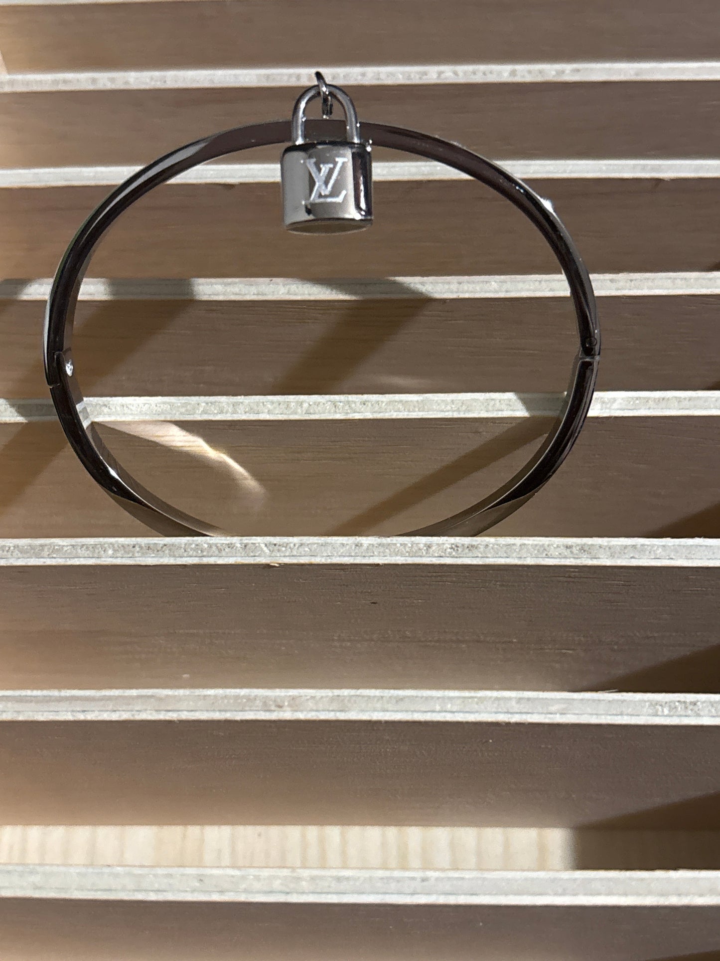Luxury Silver-Tone Monogram Motif Bangle Bracelet with Miniature Padlock Charm 🔐🪨✨