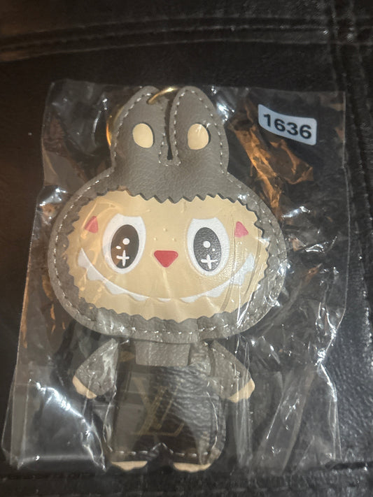 Luxury Inspired Labubu Grey Leather Bag Charm & Keychain with LV Branding & Gold Clasp 🐰🦶✨
